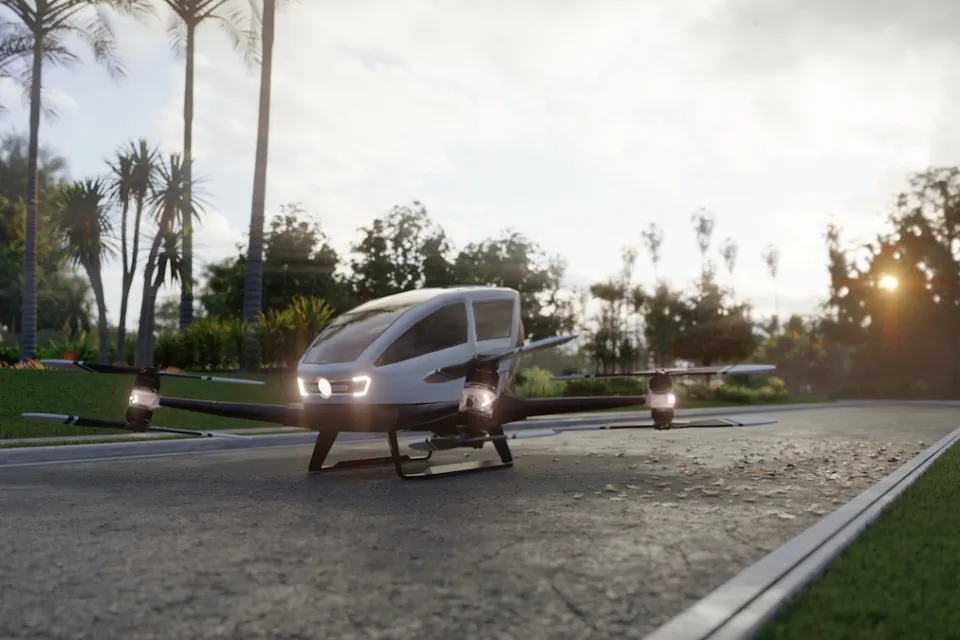 Rendering of small autonomous 'air taxi' parked on gray stone driveway.